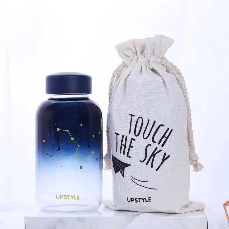 Navy blue gradient glass water bottle with constellation design and gold accents by upstyle for outdoor activities