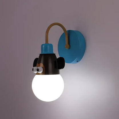 Blue wall-mounted monkey head led ceiling light with black ears and googly eyes for kids bedroom by DecorBites™