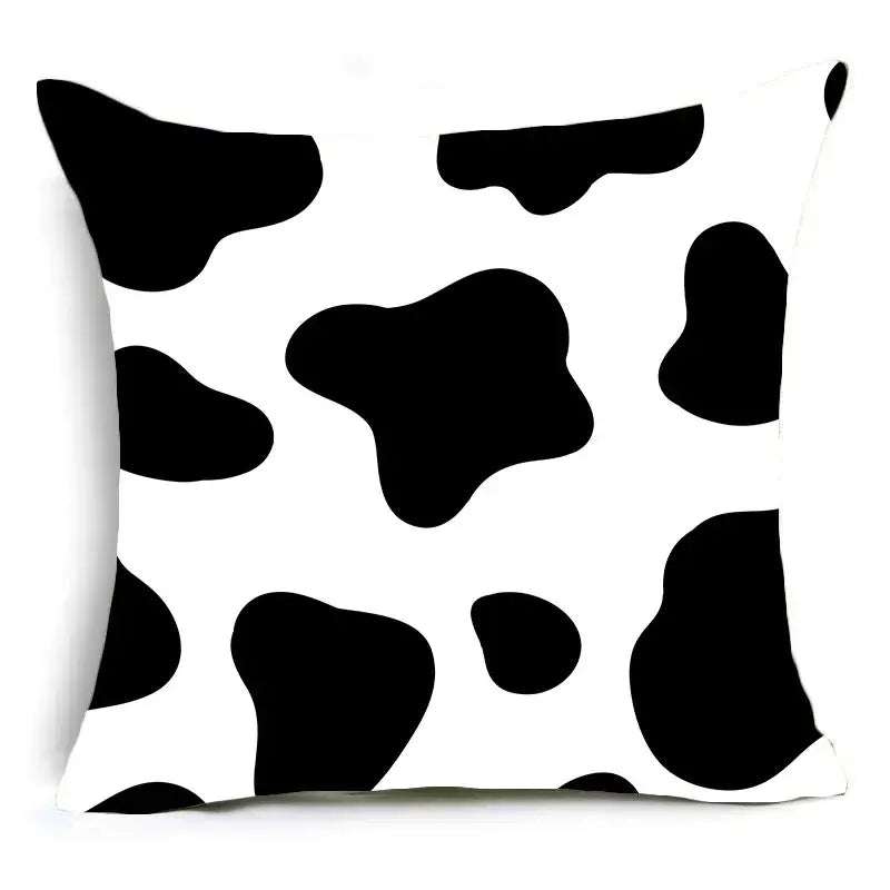 White decorBites™ animal print pillowcase cushion cover featuring black cow print pattern for sofa decoration