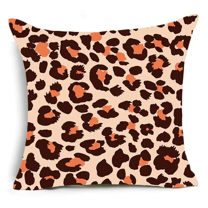 A square DecorBites™ animal print pillowcase cushion cover with bold leopard print in dark brown and orange on beige background