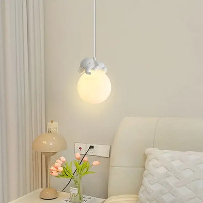 Decorbites animal resin pendant lamps featuring a soft spherical pendant light with a gray elephant resin figurine