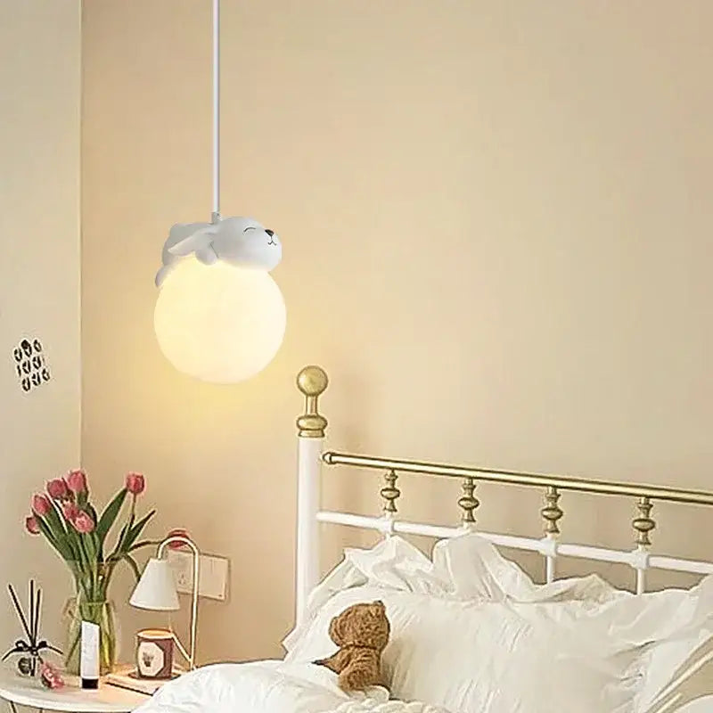 Cute white plush seal resin pendant lamp with soft glowing spherical bulb for children’s room lighting