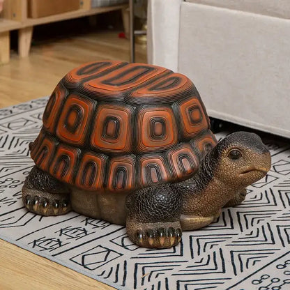DecorBites™ sculpture footstool seat featuring a lifelike tortoise figurine with glossy orange black shell and textured resin skin