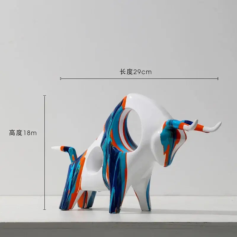 A sleek modern white animal resin statue with blue and orange abstract swirls from the DecorBites resin statue collection