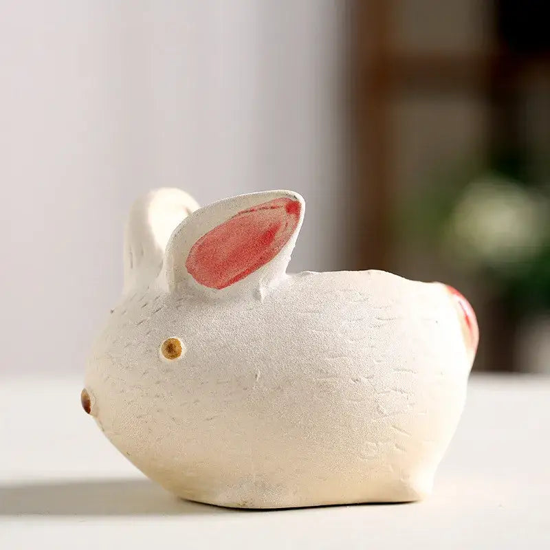 White ceramic DecorBites™ animal vase succulent pot shaped as a rabbit with pink ears and gold-colored eyes