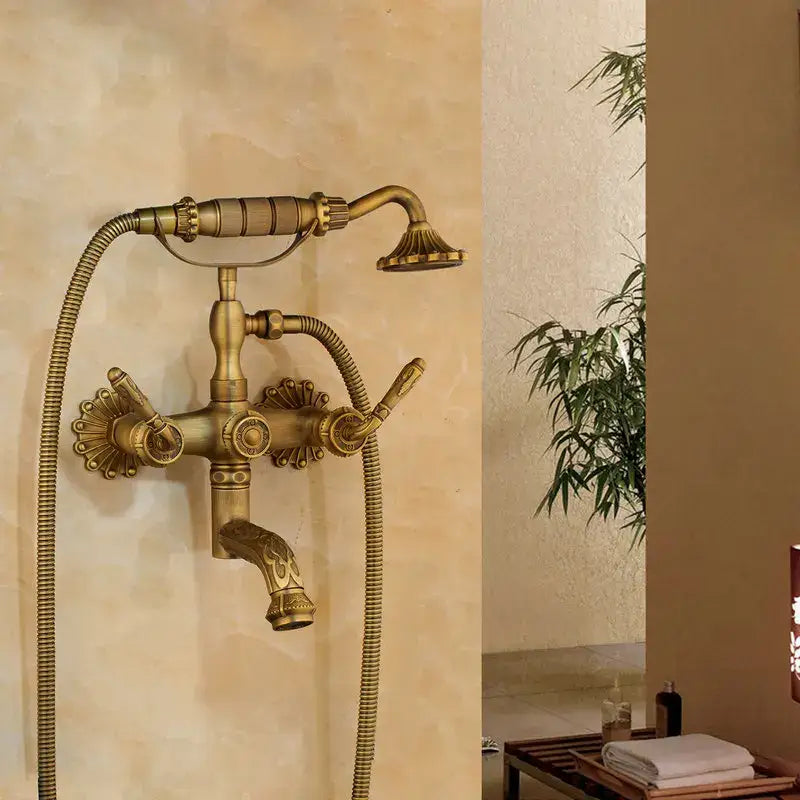 Decorbites antique brass wall mounted shower mixer set with ornate detailing and two separate hoses in vintage style