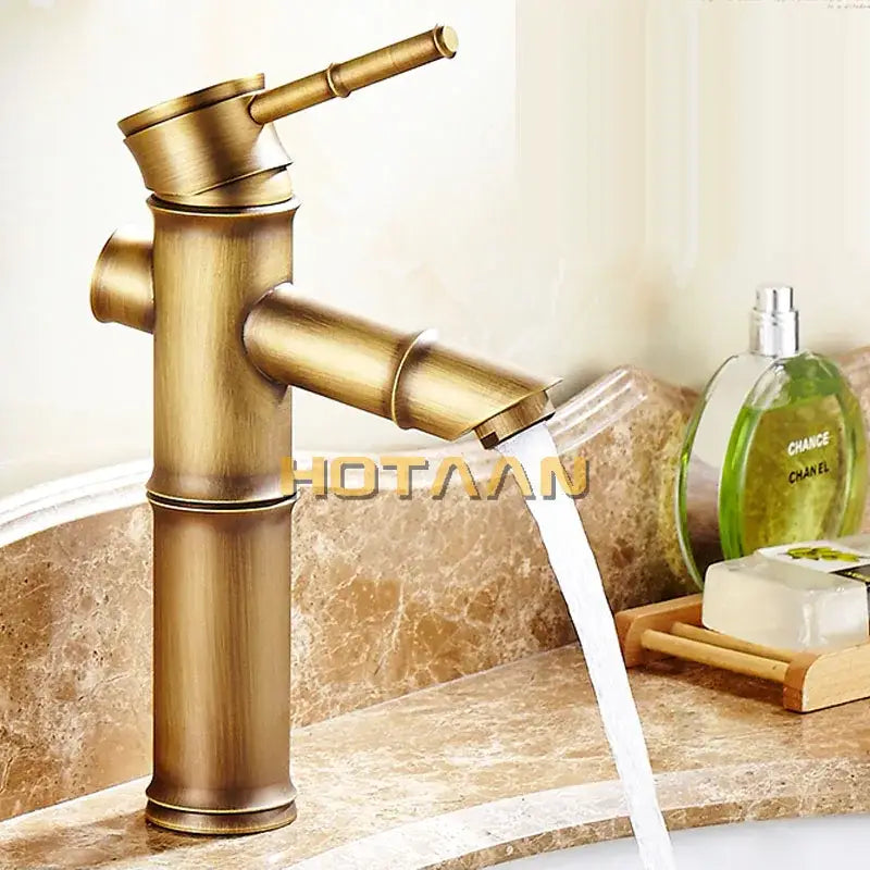 Antique brass single handle bamboo-style basin faucet by decorbites with flowing spout and elegant design