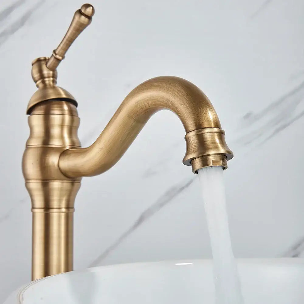 Decorbites antique brass basin faucet single handle kitchen mixer tap with curved spout and ornate detailing