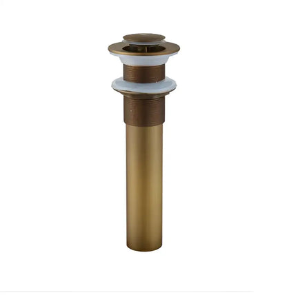 Brass-colored cylindrical antique brass basin sink drain with fluted top and white rubber gasket for basin sink installation