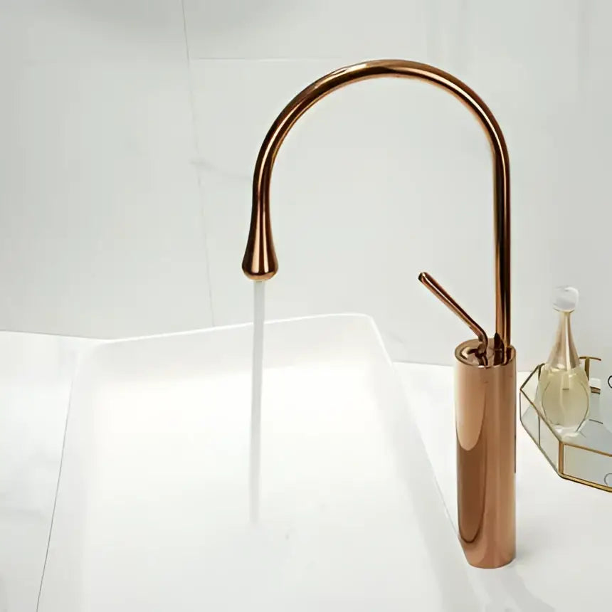 Decorbites™ antique brass bathroom basin faucet with copper finish sleek curved spout and cylindrical base