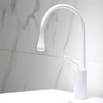 White modern basin faucet with curved spout minimalist design for antique brass bathroom basin use by DecorBites