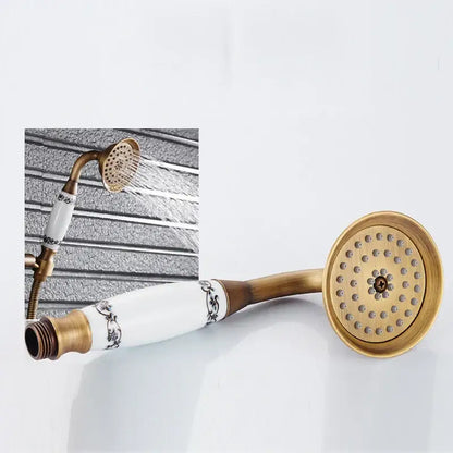 DecorBites™ antique brass shower mixer set with white ceramic handshower and ornate black floral detailing on handle