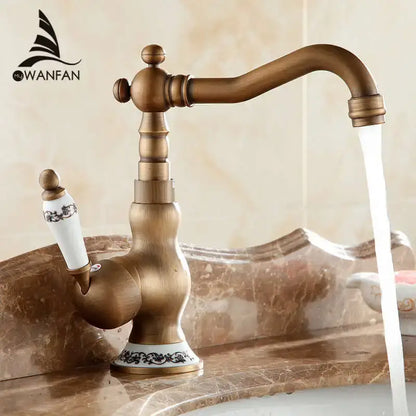 DecorBites antique brass bathroom sink faucet with white ceramic handle and black ornate detailing for hot cold mixer