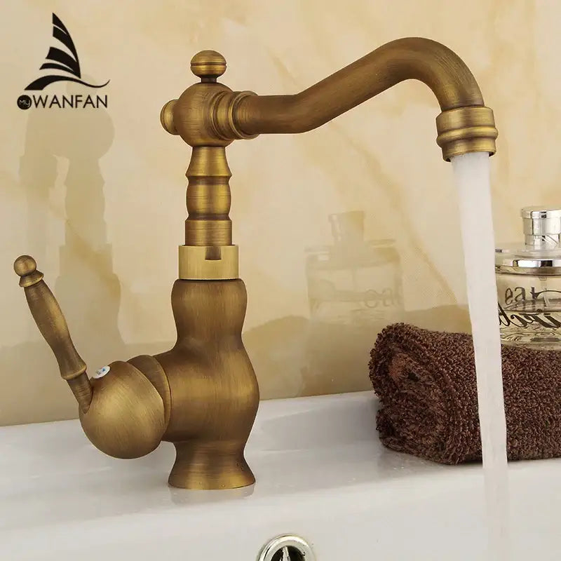 Decorbites™ antique brass bathroom sink faucet with vintage-style curved spout and single handle brass mixer tap