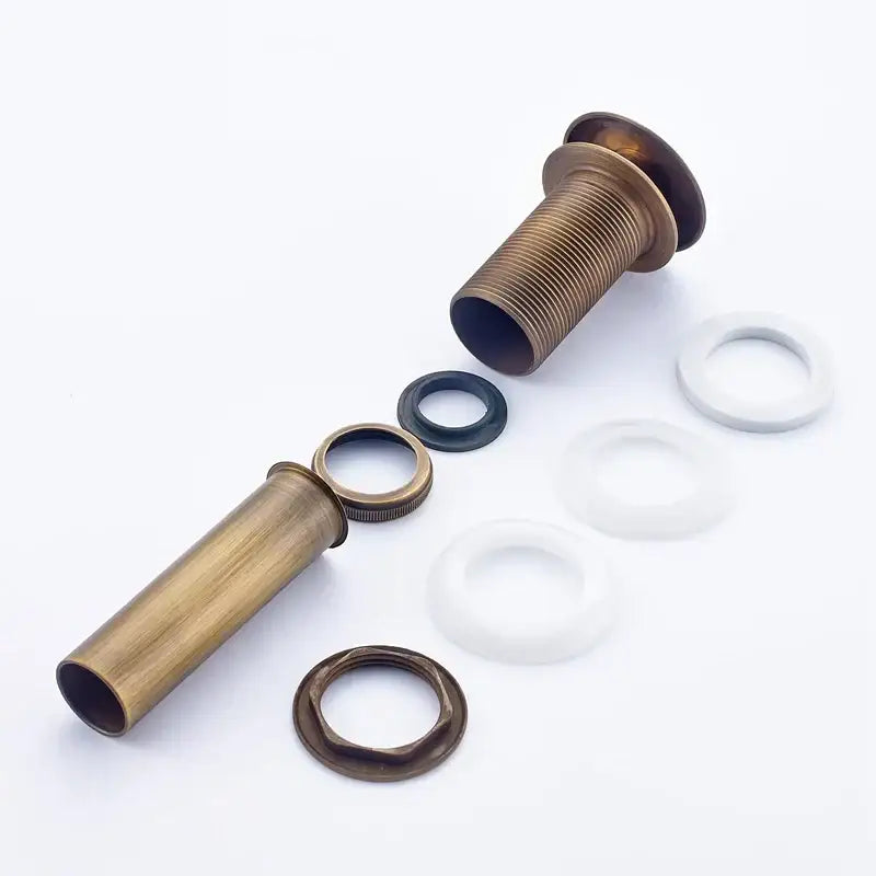Antique brass bathroom sink overflow pipe with threaded fittings and white and black rubber washers for vessel sink