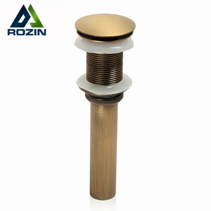 DecorBites antique brass bathroom sink pop up drain with sleek cylindrical body and white ceramic washers for vessel sink