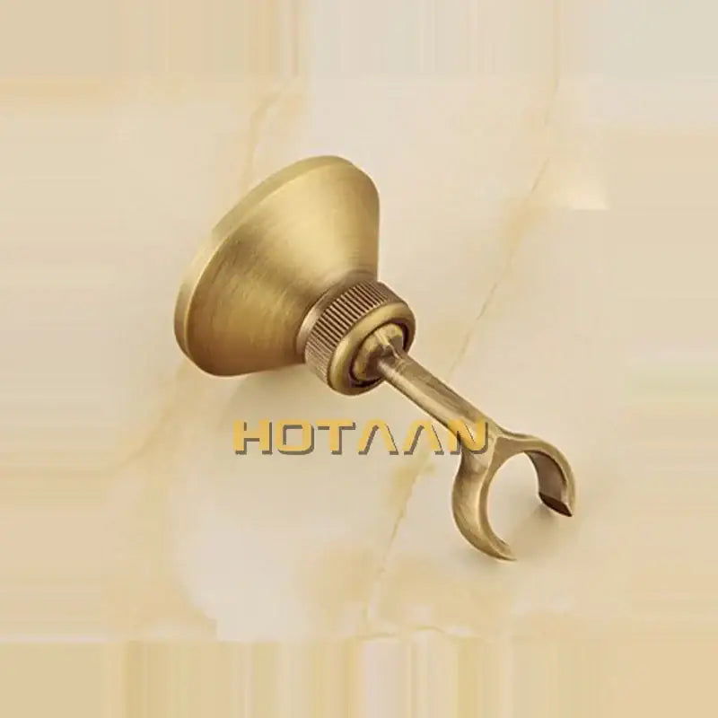 Antique brass curtain rod holder with flared base and textured knob complements decorbites antique brass bidet faucet set