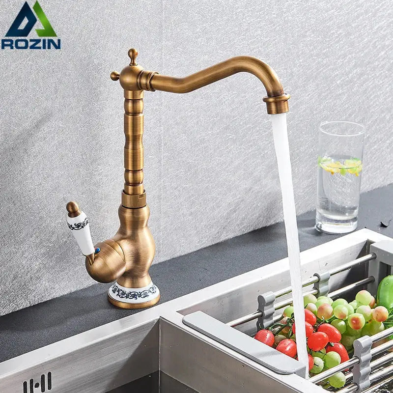 Antique brass ceramic handle basin faucet with white ceramic handle and blue floral detailing for kitchen sink deck mounting