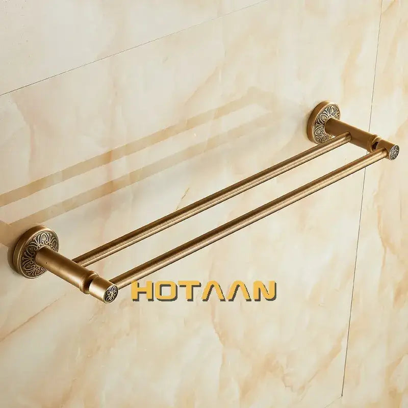 DecorBites antique brass double towel holder featuring ornate circular end caps in solid aluminium for bathroom use