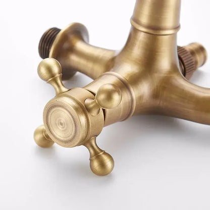 Decorbites antique brass garden bibcock with cross-handle knobs and central spout for outdoor use