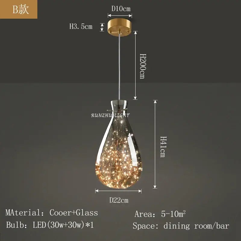 A modern teardrop-shaped DecorBites™ antique brass glass chandelier with clear glass and warm LED lights for dining room and bar