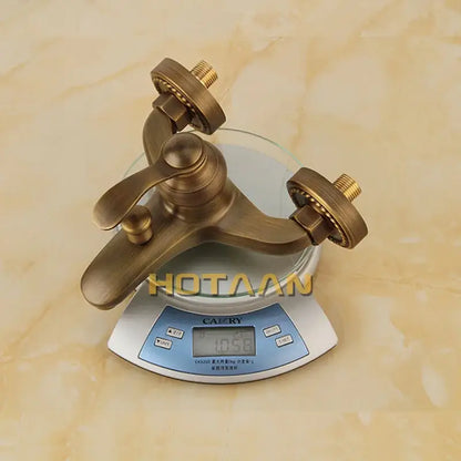Decorbites antique brass bathroom faucet with classic design and two handles for hot and cold water in shower head kit