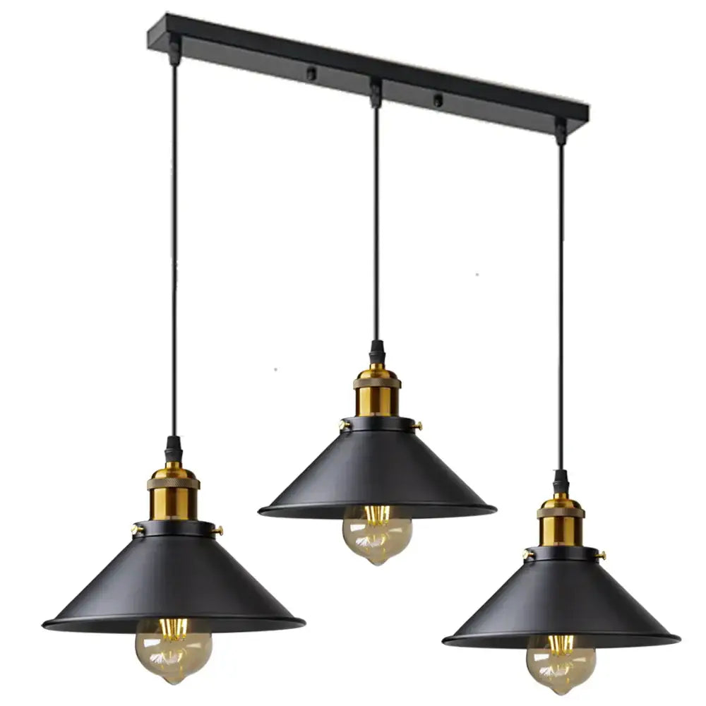 Black industrial-style DecorBites antique brass kitchen pendant light with brass accents and exposed filament bulbs