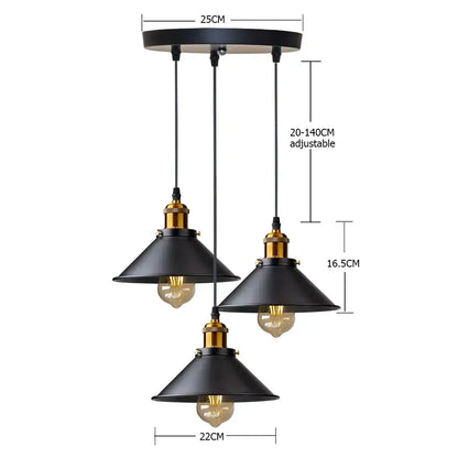 Black industrial pendant light fixture with three conical shades and brass accents for antique brass kitchen use