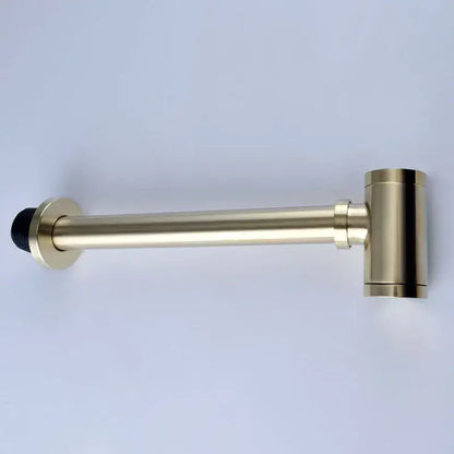 Gold-finished metal door stop with black rubber tip complementing antique brass bathroom sink drain kit accessories