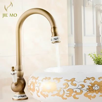 DecorBites antique brass porcelain basin mixer kitchen faucet with ornate white ceramic handle and silver inlay accents