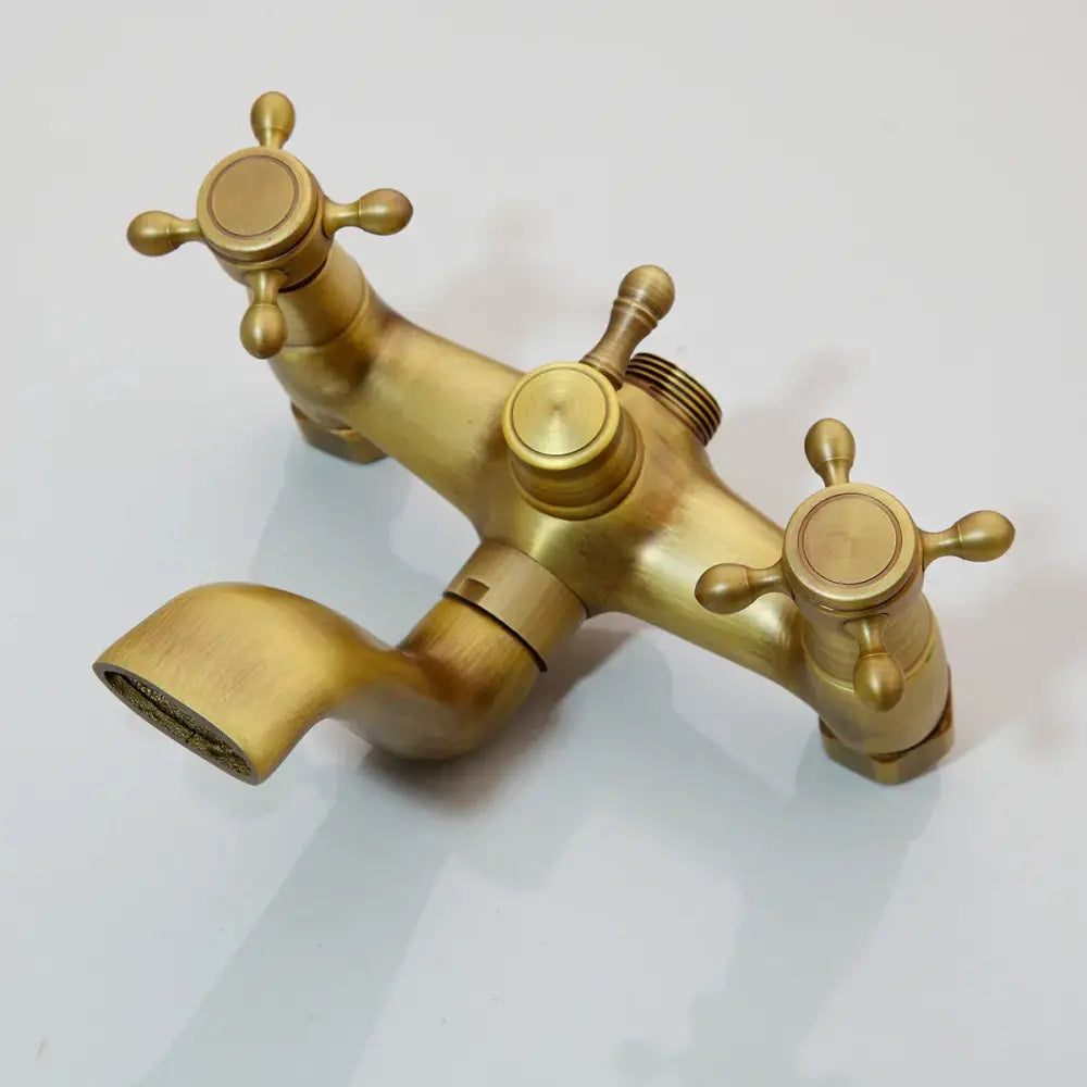 Brass-finished decorbites™ antique brass shower faucet set with three cross handles and curved spout for rainfall shower