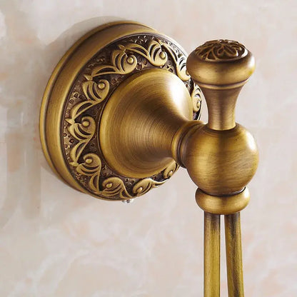 Antique brass robe hooks by decorbites with ornate floral detailing and vintage-inspired design for bathroom use
