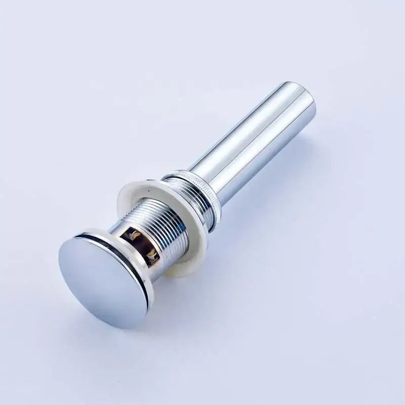 Decorbites™ antique brass brass round siphon bathroom sink drain with chrome finish and threaded connection