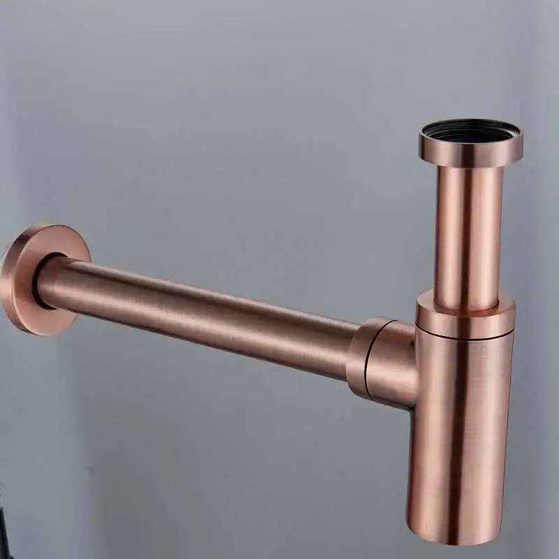 Decorbites antique brass round siphon p-trap sink drain pipe in copper-toned brushed metal with minimalist design