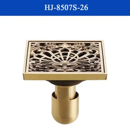 DecorBites™ antique brass shower drain cover with brass finish and intricate floral scrollwork design for bathroom use