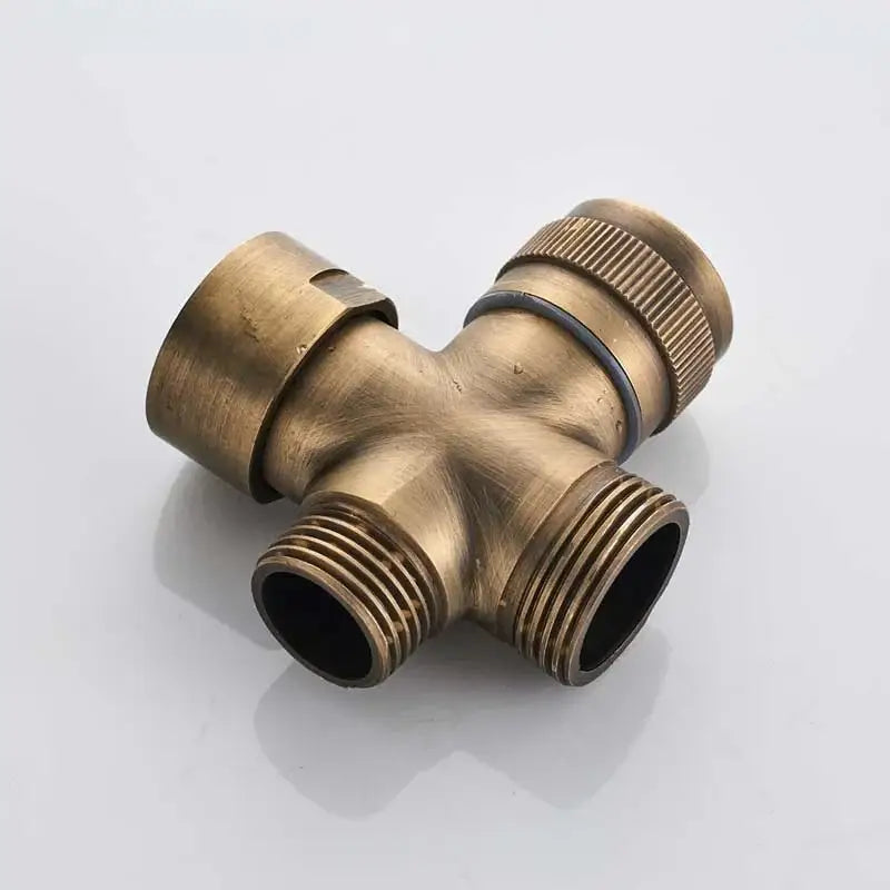 Antique brass shower faucet set featuring a three-way plumbing tee with threaded connections and knurled cap