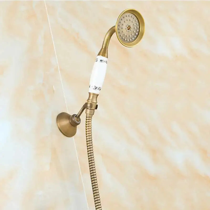 DecorBites™ antique brass shower set with flexible metal hose and white ceramic handle featuring black floral patterns