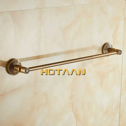 Decorbites™ antique brass single towel bar featuring ornate floral-patterned circular ends wall mounted holder
