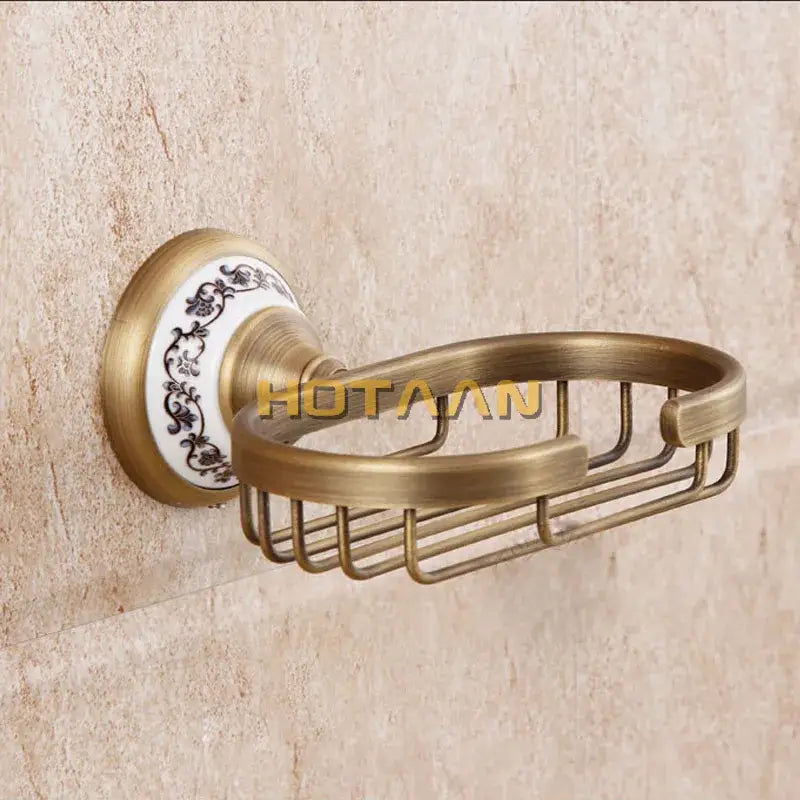 DecorBites antique brass soap holder with decorative white ceramic base featuring black floral patterns for bathroom use