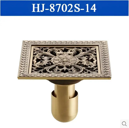 Decorbites™ antique brass square floor drain with ornate floral engraving and beaded border for shower floors