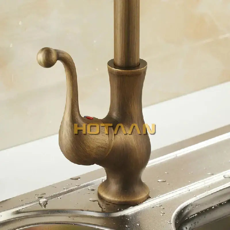 DecorBites antique brass swivel basin mixer tap with curved spout and vintage ornate design in brass finish