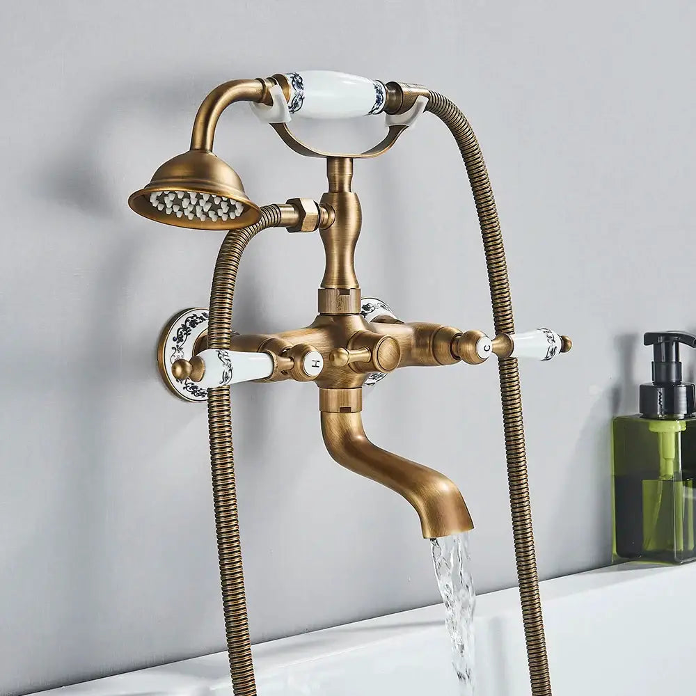 Decorbites™ antique brass telephone shape wall mounted bathtub faucet with white ceramic handles and detachable showerhead