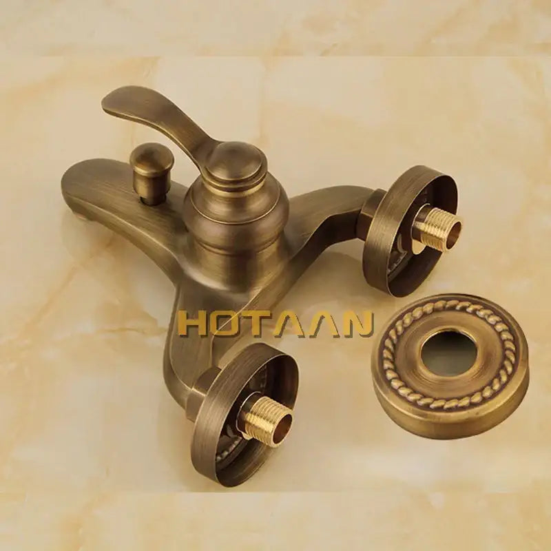 Antique brass wall mount bathtub faucet with ornate design and decorative escutcheon in decorbites shower head kit