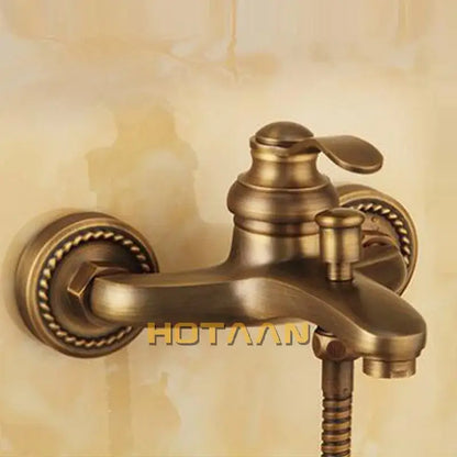 Decorbites™ antique brass wall mount shower head kit with ornate rope detailing and classic curved spout faucet