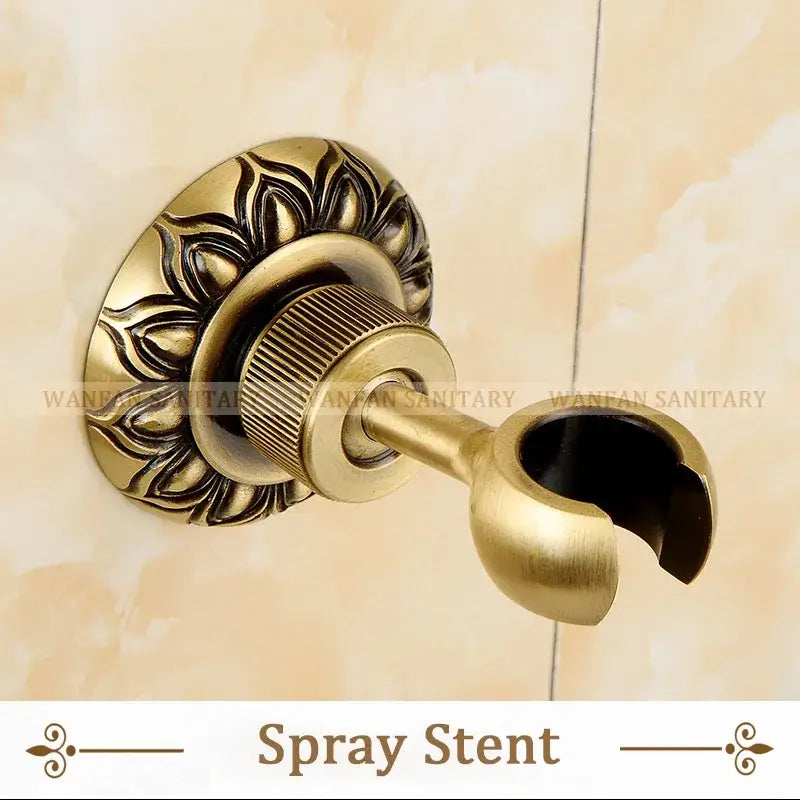 Decorbites antique brass wall mounted bidet faucet with ornate floral mounting plate and ribbed adjustment knob