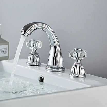 Decorbites antique bronze hole widespread basin faucet with chrome finish and faceted crystal knobs on white sink