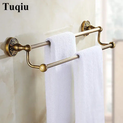Antique brass double towel rack with ornate floral mounts and spherical finials in decorbites bathroom accessories set