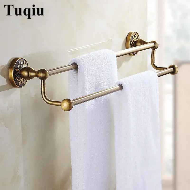 Antique brass double towel rack with ornate floral mounts and spherical finials in decorbites bathroom accessories set