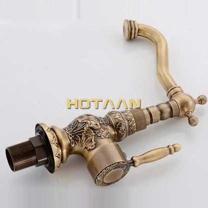 DecorBites antique bronze kitchen basin faucet with ornate floral embossing, curved spout, and dual lever handles