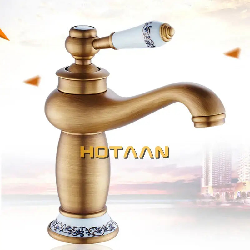 DecorBites™ antique bronze single handle basin faucet with brass finish and white ceramic handle with blue floral patterns
